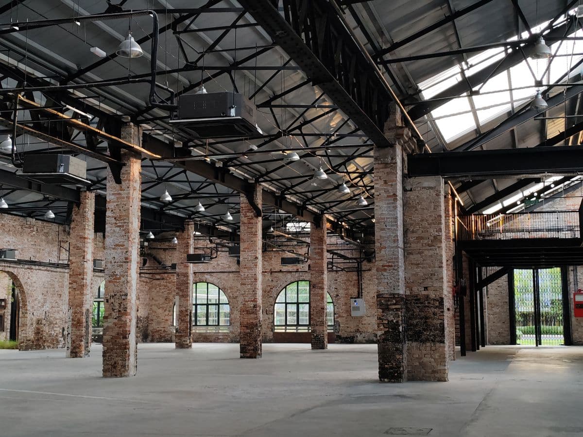 Brick-and-steel commercial interior with open floor space